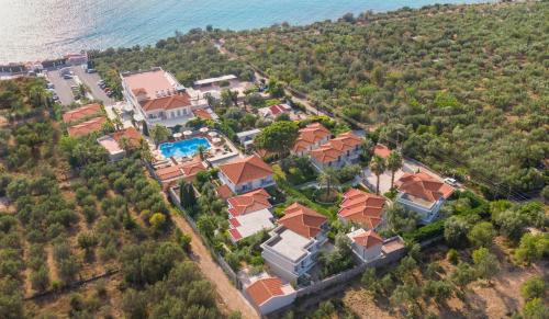 an aerial view of a house on a hill next to the water at Akti Taygetos - Conference Resort in Kalamata