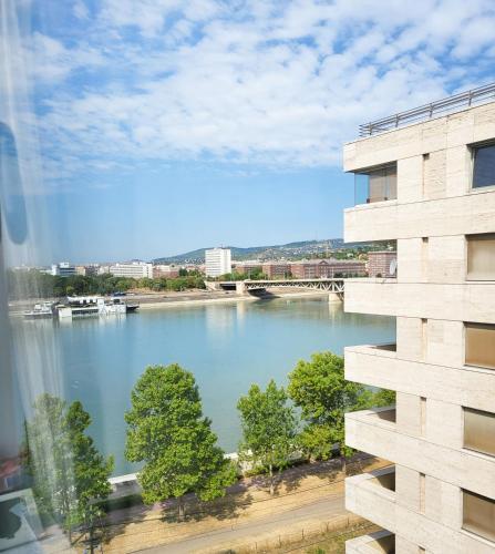 a view of a river from a building at Budapest - Duna part in Budapest