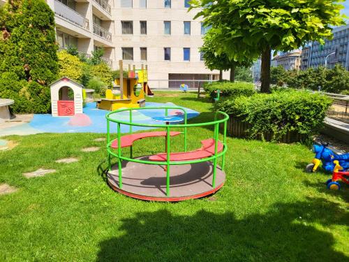 a playground with a trampoline in the grass at Budapest - Duna part in Budapest