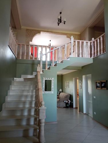 a stairway in a home with a staircase at Casa Andrei in Haţeg