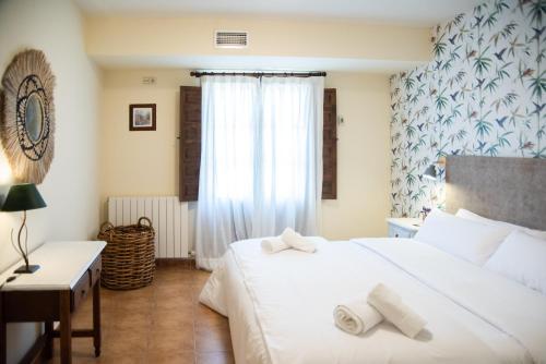 Postel nebo postele na pokoji v ubytování Posada de Zorita de los Canes