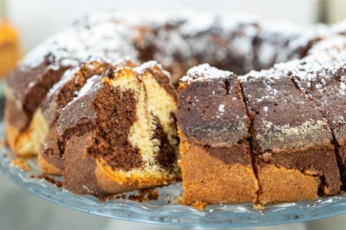 a close up of a glass plate with chocolate cake at Il Crepuscolo Marzamemi in Marzamemi