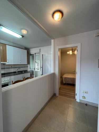 Kuchyň nebo kuchyňský kout v ubytování Apartamento playa A Ribeira