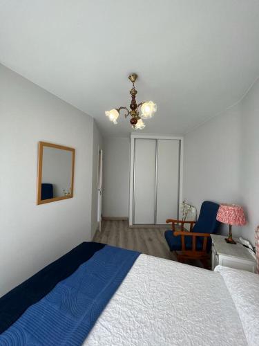 Postel nebo postele na pokoji v ubytování Apartamento playa A Ribeira