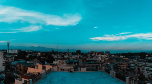a view of the city from the rooftop of a building at Hotel Doon's Pride in Dehradun