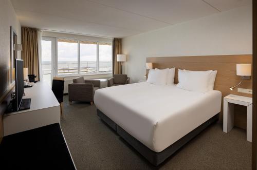 Postel nebo postele na pokoji v ubytování WestCord Hotel Schylge
