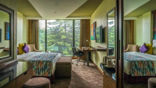 Postel nebo postele na pokoji v ubytování Sarova Panafric Hotel