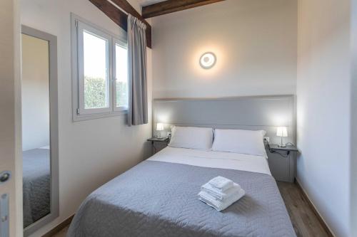 Ένα ή περισσότερα κρεβάτια σε δωμάτιο στο Green House in Villa con Piscina