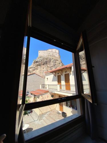 a view from a window of a building with a mountain in the background at Roxani Studios-Apartments in Petra