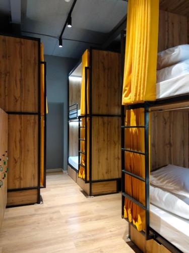 a room with three bunk beds in it at Hostel Bro Astana in Astana