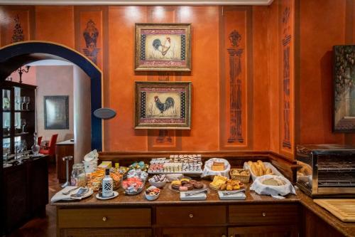 a buffet of food on a table in a room at Hotel Soho Boutique Vistahermosa in El Puerto de Santa María