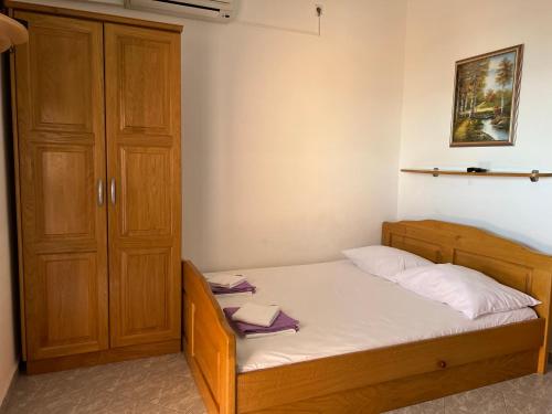 Postel nebo postele na pokoji v ubytování Apartmani Kovačić