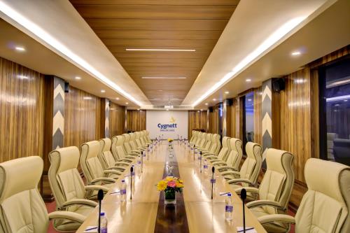 a conference room with a long table and chairs at Cygnett Inn Trendz in Itānagar