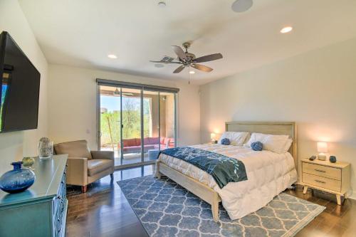 a bedroom with a bed and a ceiling fan at Sunny Scottsdale Condo with Resort-Style Perks! in Scottsdale