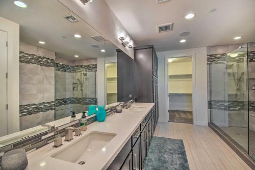 a large bathroom with two sinks and a shower at Sunny Scottsdale Condo with Resort-Style Perks! in Scottsdale