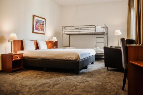 Ένα ή περισσότερα κρεβάτια σε δωμάτιο στο Hotel ten Cate Emmen