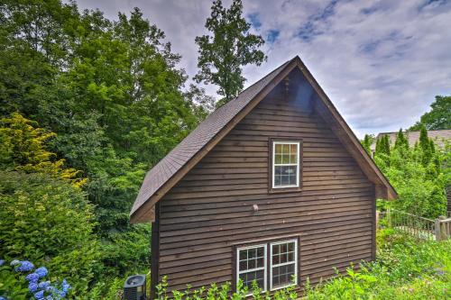 a small house with a gambrel roof at Cozy Boone Cabin with Deck Close to Downtown! in Boone