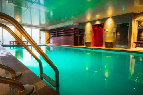 a swimming pool in a hotel room with at Ilsington Country House Hotel & Spa in Ilsington