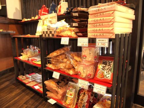 a display of food on a shelf in a store at Onsen Urashima in Onomichi