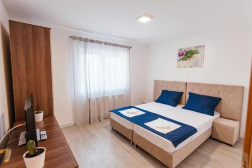 En eller flere senge i et værelse på Apartment Stari Pazar