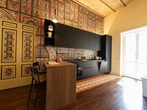 a kitchen with a wooden island in a room at The Best Rent - Elegant two-bedroom apartment close to Saint Peter's Basilica in Rome