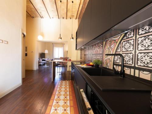 a kitchen with a sink and a counter top at The Best Rent - Elegant two-bedroom apartment close to Saint Peter's Basilica in Rome