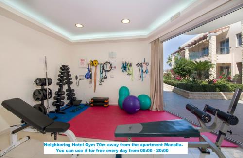 a room with a gym with exercise equipment and balloons at Manolia Dream Apartment 3-bedrooms 30m to the beach in Agia Marina Nea Kydonias
