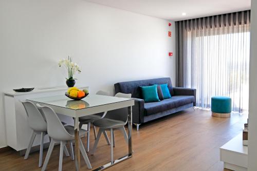 a living room with a table and a couch at Monte Bela Vista in Macedo de Cavaleiros