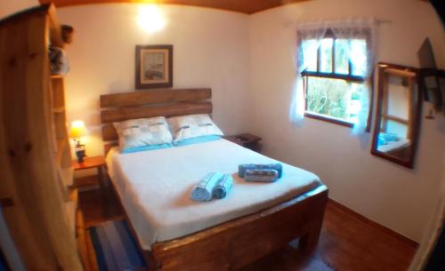 Llit o llits en una habitació de Chalé Honeycomb em Visconde de Mauá