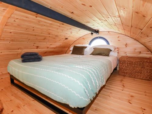 Un pat sau paturi într-o cameră la The Olju