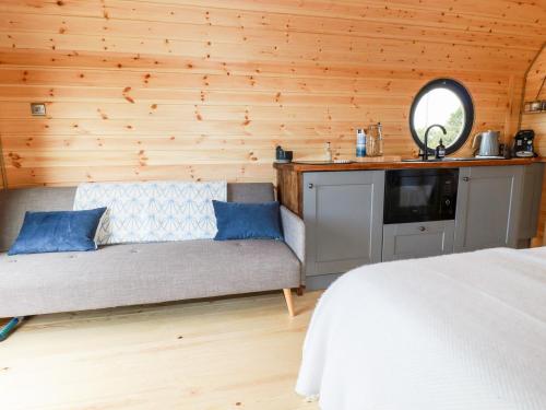 a bedroom with a bed and a mirror on a wall at Stargaze in Truro