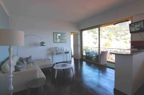 a living room with a couch and a table at Excellent location - Sea Views in Villefranche-sur-Mer