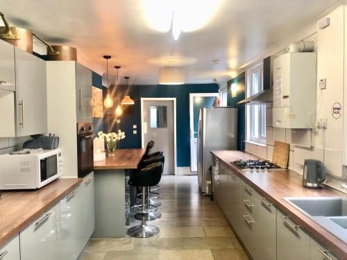 a kitchen with white cabinets and a counter top at 4Alma St in Plymouth