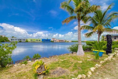 a view of a large body of water with palm trees at Suite F201 @ Mara Laguna in San Pedro