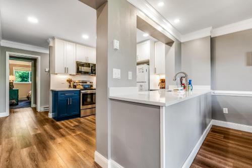 a kitchen with white cabinets and a counter top at Sugar Ski 632 in Sugar Mountain