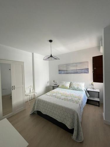 מיטה או מיטות בחדר ב-Luz de la Caleta