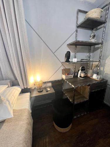 a bedroom with a bed and a desk with a lamp at Global Home - Aparthotel - No Contact Check In in Mielec