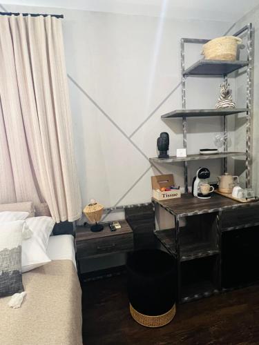 a bedroom with a bed and a desk and shelves at Global Home - Aparthotel - No Contact Check In in Mielec