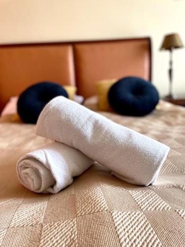 a towel sitting on top of a bed at Sarenka in Białka Tatrzańska