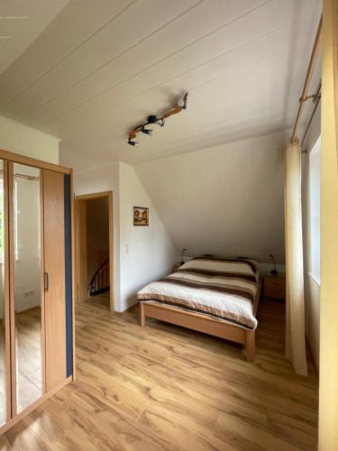 a bedroom with a bed in a attic at Ferienwohnung Justus in Aurich