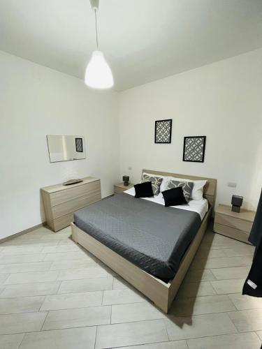 a bedroom with a large bed in a room at La Casa sul Duomo in Terni