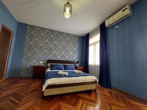 Ένα ή περισσότερα κρεβάτια σε δωμάτιο στο Guesthouse ''Door'' in Sighnaghi