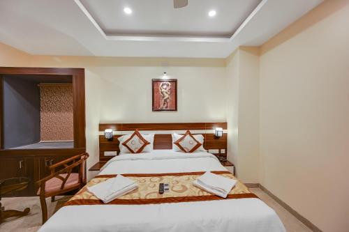a hotel room with two beds and a window at HOTEL SJ PRIDE in Bhubaneshwar