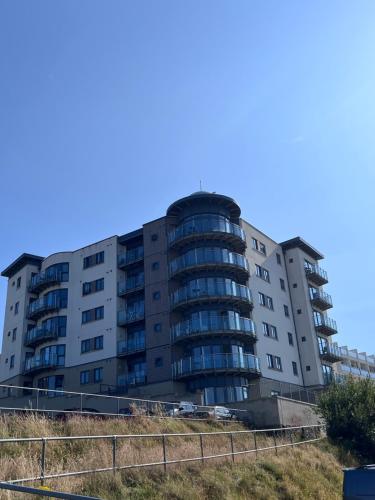 an apartment building on the side of the road at Newquay Horizons in Newquay