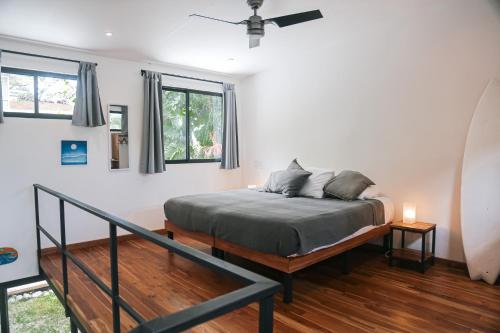 a bedroom with a bed in a room at El Hábita CASA MAR in Santa Teresa Beach