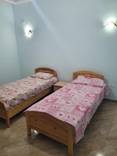 Postel nebo postele na pokoji v ubytování Miriam Apartments