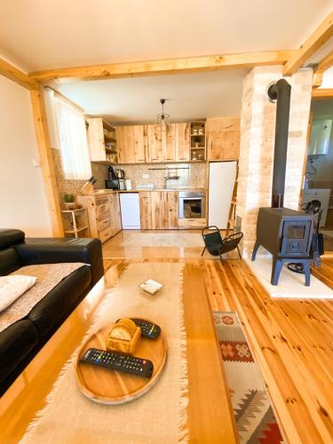 a living room with a couch and a table at Guest House SARA in Žabljak