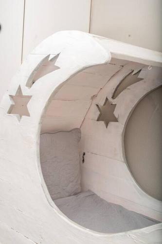 a childs bed with stars on the side of it at HomeSweetHome Farm Cottage in Nelspruit