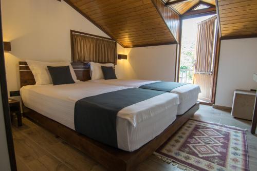 Postel nebo postele na pokoji v ubytování KALE GUESTHOUSE