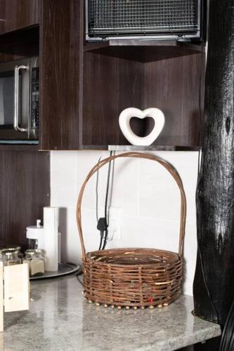 a basket sitting on a counter in a kitchen at HomeSweetHome Farm Cottage in Nelspruit